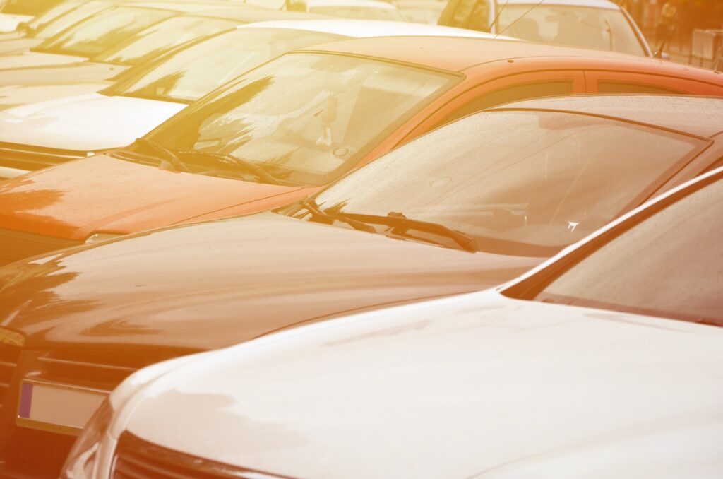 Roofs of several cars. A lot of cars stand close at rush hour